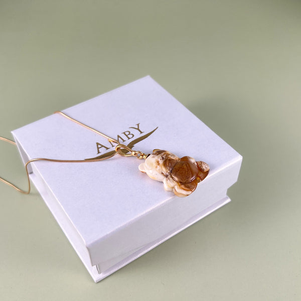 Gintaro pakabukas, auksuotas sidabras 925 "Saulės apkabinimas"