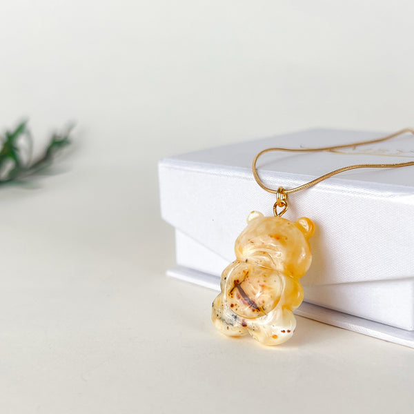 Gintaro pakabukas, auksuotas sidabras 925 "Saulės apkabinimas"