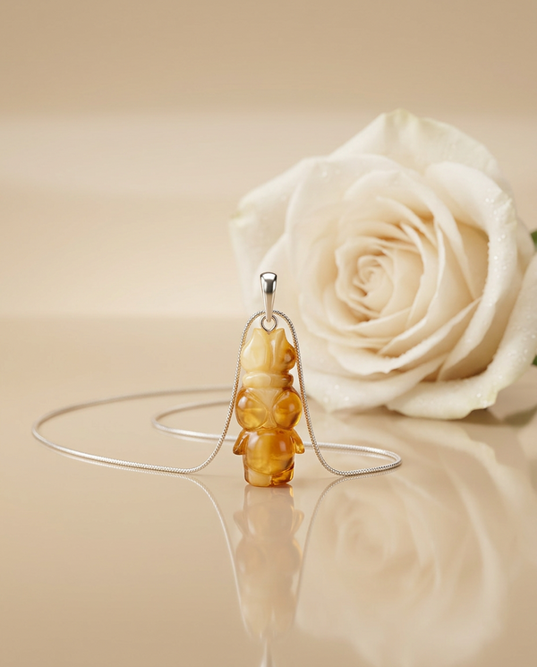 gintaro pakabukas su sidabru